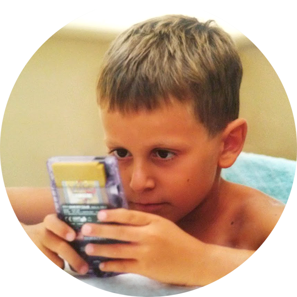 Picture of Lord Broblord as a kid playing Pokémon on a Game Boy